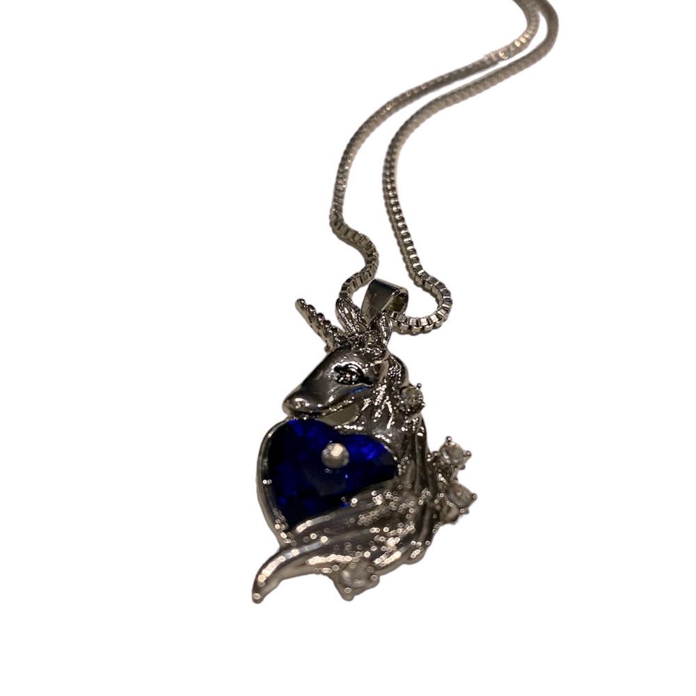 The Last Unicorn pendant and chain. Silver tone with blue and clear glass